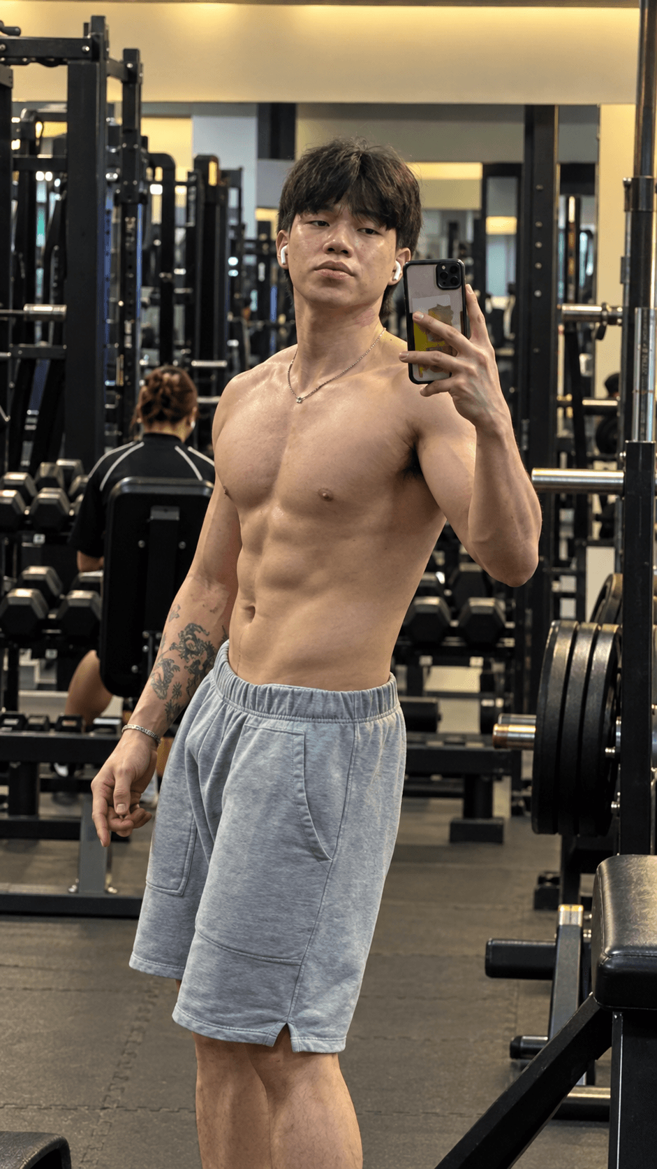 Clyde Teng taking a mirror selfie in his training gym